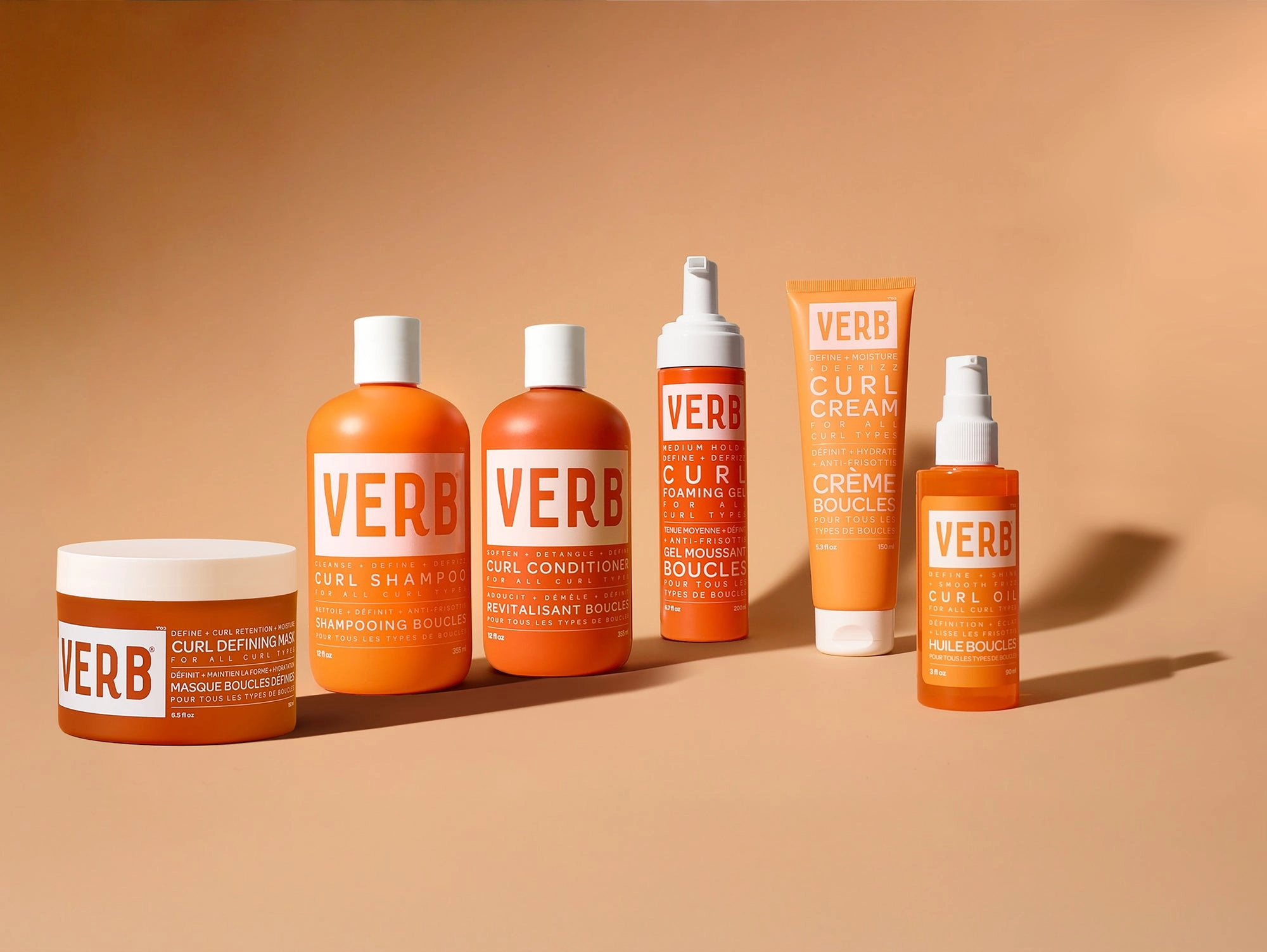 Curl products in orange bottles and a jar